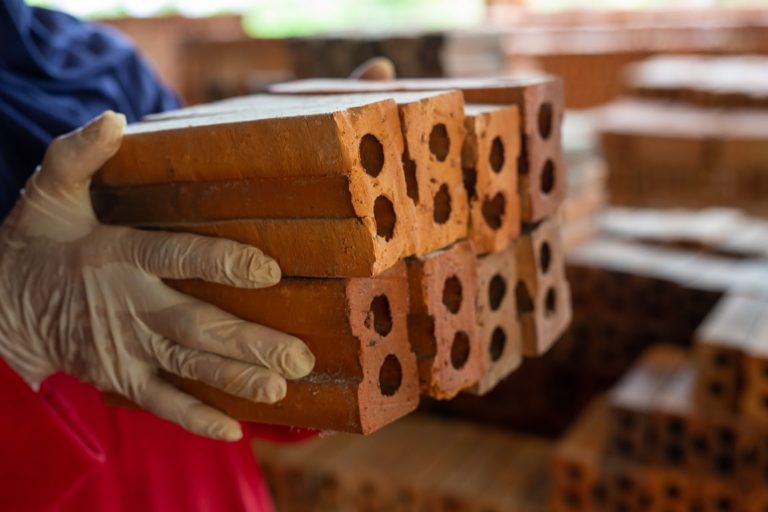 brick-piles-placed-on-the-factory-floor-min